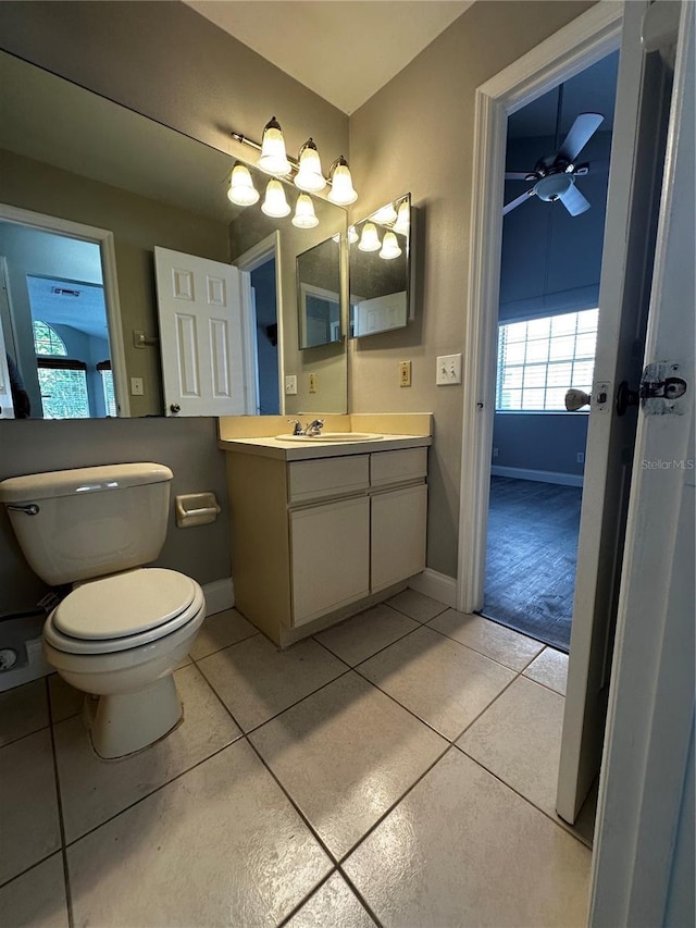 652 Roaring Dr Unit 234, Altamonte Springs, FL 32714 - bathroom with tile patterned floors, toilet, vanity, and baseboards