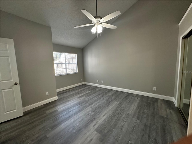 652 Roaring Dr Unit 234, Altamonte Springs, FL 32714 - unfurnished bedroom featuring vaulted ceiling, dark wood-style floors, baseboards, a textured ceiling, and ceiling fan