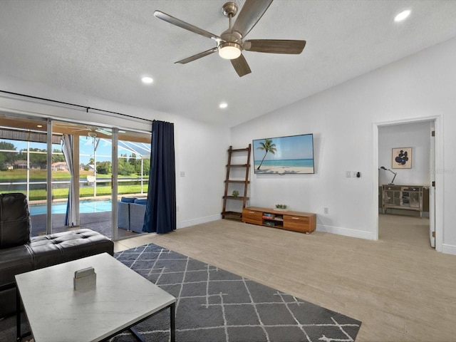 703 Sunridge Woods Blvd, Davenport, FL 33837 - living area featuring ceiling fan, lofted ceiling, baseboards, recessed lighting, and wood finished floors