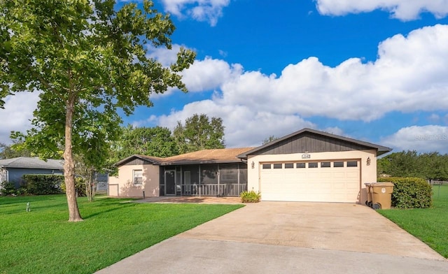 1242 Liza St, Saint Cloud, FL 34771 - ranch-style house featuring a sunroom, a garage, driveway, and a front yard
