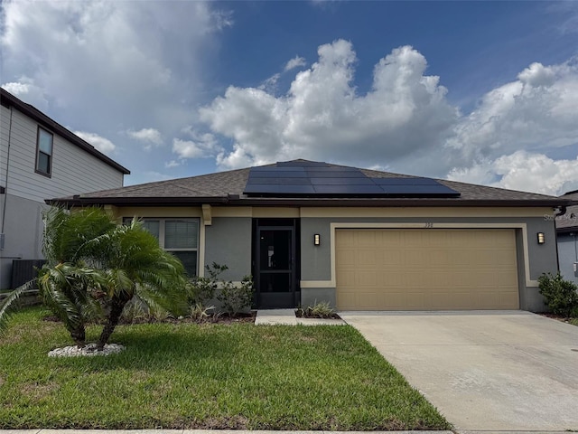 398 Citrus Isle Loop, Davenport, FL 33837 - prairie-style home featuring stucco siding, roof mounted solar panels, concrete driveway, and a front yard