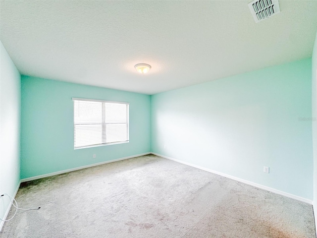 398 Citrus Isle Loop, Davenport, FL 33837 - empty room with carpet floors, baseboards, and a textured ceiling
