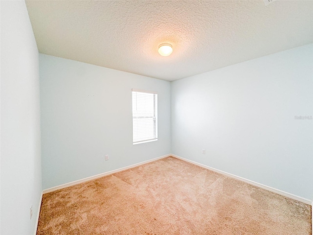 398 Citrus Isle Loop, Davenport, FL 33837 - empty room featuring carpet flooring, baseboards, and a textured ceiling