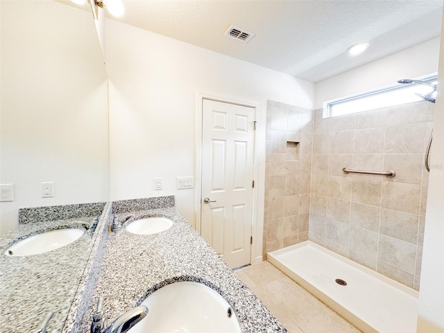 398 Citrus Isle Loop, Davenport, FL 33837 - full bath with double vanity, tile patterned floors, and tiled shower