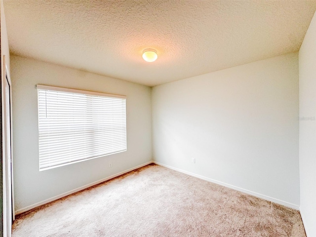 398 Citrus Isle Loop, Davenport, FL 33837 - carpeted empty room with baseboards and a textured ceiling