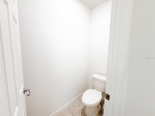 398 Citrus Isle Loop, Davenport, FL 33837 - bathroom with toilet and baseboards