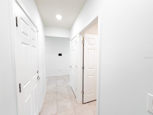 398 Citrus Isle Loop, Davenport, FL 33837 - hallway with light tile patterned flooring and baseboards