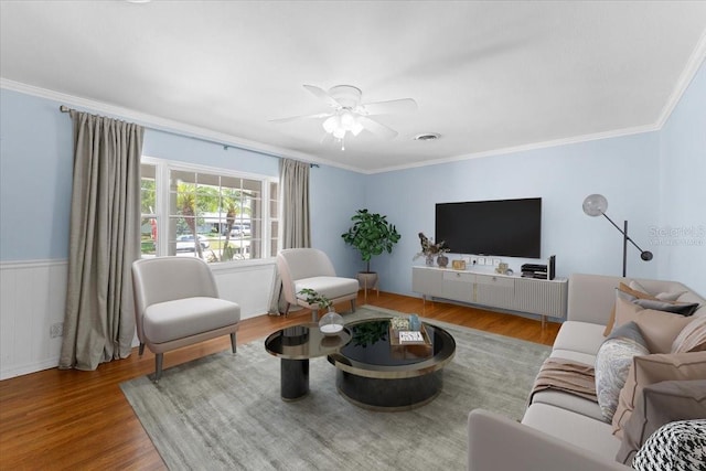 2020 Geronimo Trl, Maitland, FL 32751 - living room with ornamental molding, ceiling fan, wood finished floors, and wainscoting