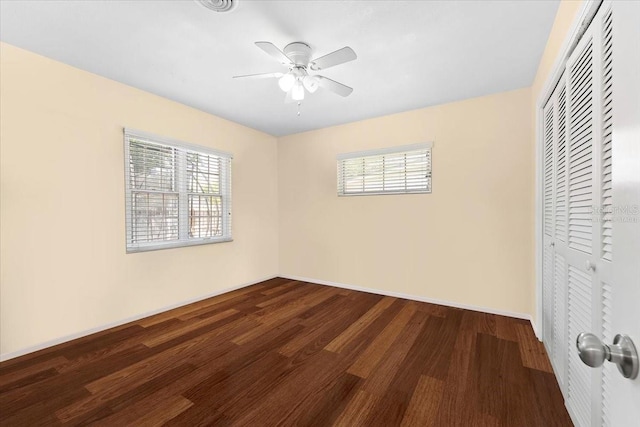 2020 Geronimo Trl, Maitland, FL 32751 - unfurnished bedroom featuring multiple windows, a closet, wood finished floors, and baseboards