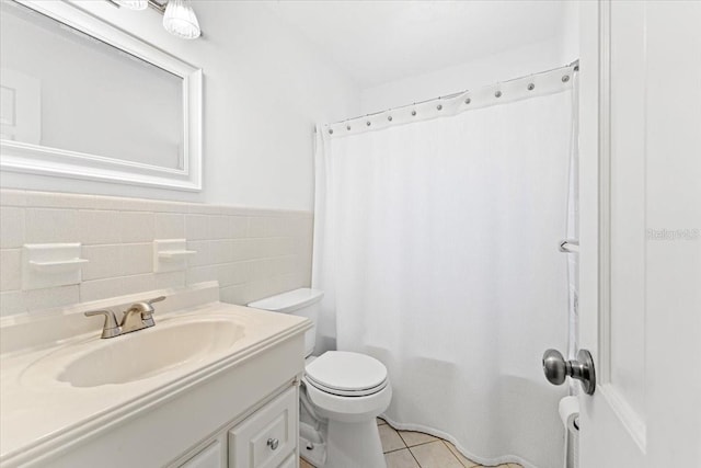 2020 Geronimo Trl, Maitland, FL 32751 - full bathroom with vanity, toilet, tile walls, tile patterned flooring, and a shower with curtain