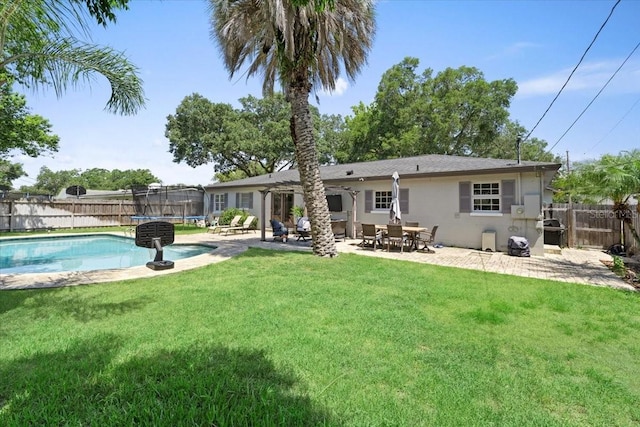 2020 Geronimo Trl, Maitland, FL 32751 - back of property featuring a trampoline and a patio area