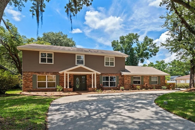 120 Springwood Trl, Altamonte Springs, FL 32714 - traditional home featuring brick siding and a front yard