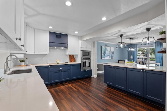 120 Springwood Trl, Altamonte Springs, FL 32714 - kitchen featuring appliances with stainless steel finishes, blue cabinetry, a sink, white cabinets, and recessed lighting