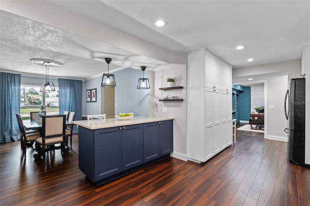 120 Springwood Trl, Altamonte Springs, FL 32714 - kitchen featuring freestanding refrigerator, a peninsula, dark wood-style floors, light countertops, and baseboards