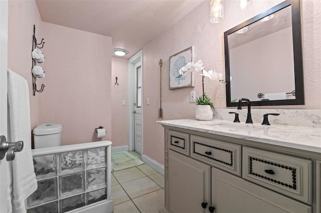 120 Springwood Trl, Altamonte Springs, FL 32714 - bathroom featuring vanity, toilet, a textured wall, tile patterned floors, and a textured ceiling