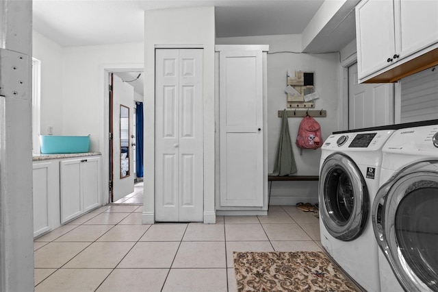 120 Springwood Trl, Altamonte Springs, FL 32714 - laundry area with washing machine and clothes dryer, cabinet space, and light tile patterned floors
