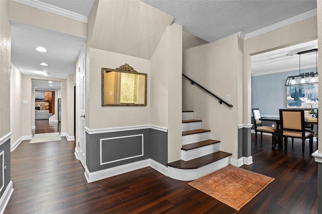 120 Springwood Trl, Altamonte Springs, FL 32714 - stairway with hardwood / wood-style flooring, crown molding, a textured ceiling, and baseboards