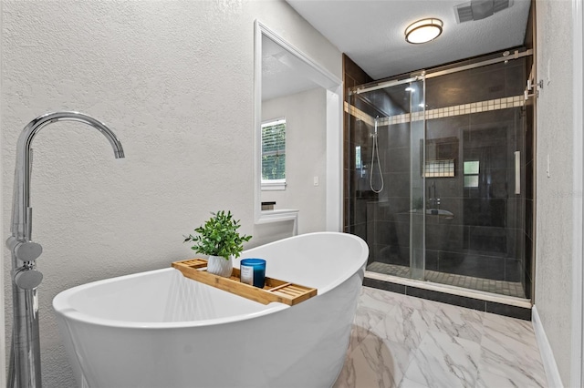120 Springwood Trl, Altamonte Springs, FL 32714 - full bathroom featuring a textured wall, a stall shower, marble look tiles, and a freestanding bath