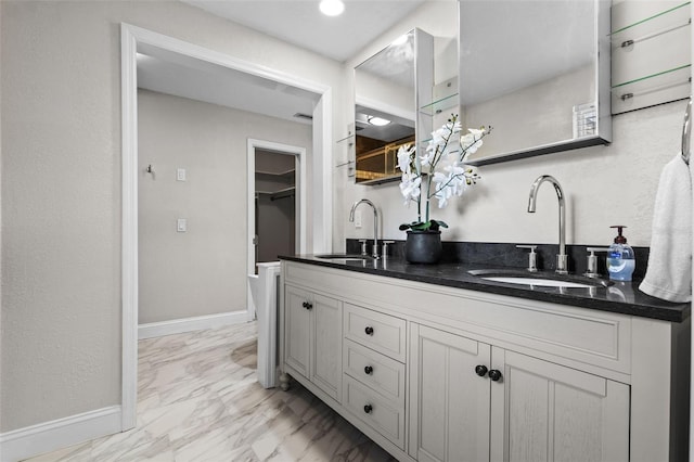 120 Springwood Trl, Altamonte Springs, FL 32714 - kitchen featuring a sink, light marble finish flooring, baseboards, and white cabinets