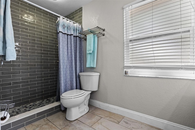 120 Springwood Trl, Altamonte Springs, FL 32714 - bathroom with toilet, a tile shower, baseboards, and healthy amount of natural light