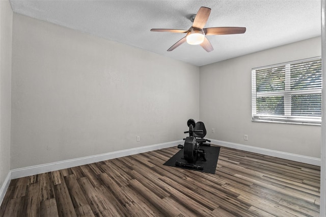120 Springwood Trl, Altamonte Springs, FL 32714 - exercise room with dark wood finished floors, a textured ceiling, baseboards, and a ceiling fan
