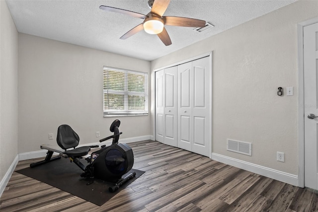 120 Springwood Trl, Altamonte Springs, FL 32714 - exercise room featuring wood finished floors, baseboards, a textured ceiling, and ceiling fan