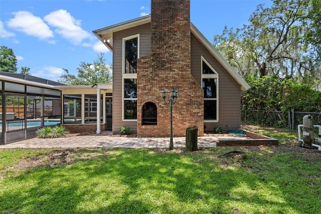 120 Springwood Trl, Altamonte Springs, FL 32714 - back of house featuring a chimney, a patio, and an outdoor pool