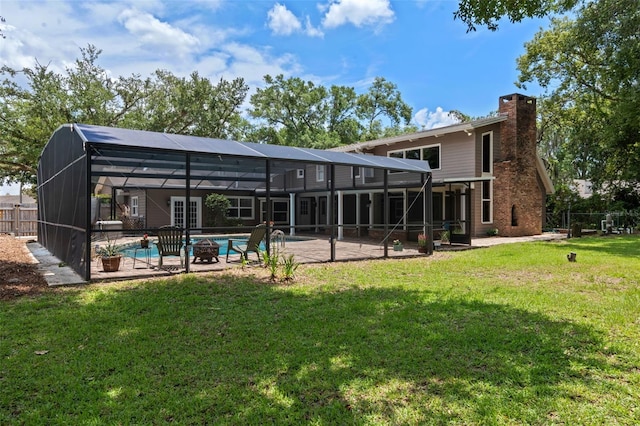 120 Springwood Trl, Altamonte Springs, FL 32714 - rear view of house with a patio area, a chimney, and glass enclosure