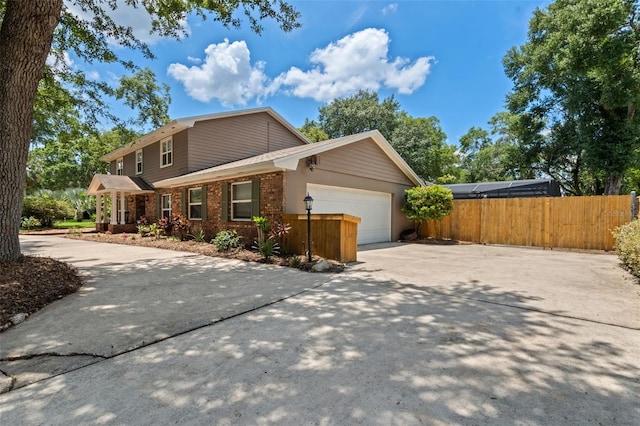 120 Springwood Trl, Altamonte Springs, FL 32714 - view of front of house with driveway, a garage, and brick siding