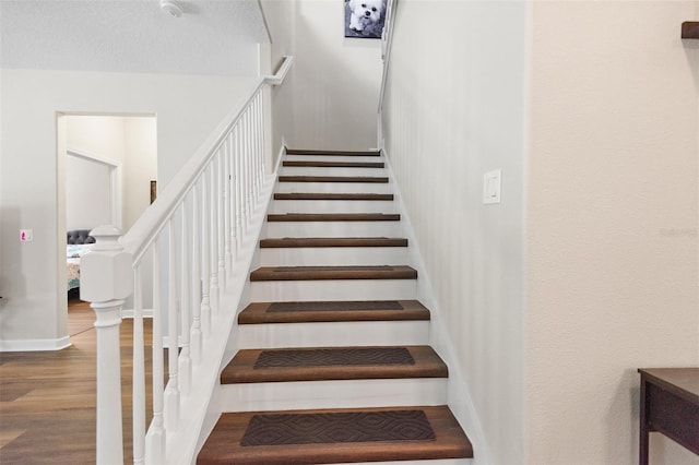 6333 Schoolhouse Pond Rd, Winter Garden, FL 34787 - stairs with wood finished floors and baseboards