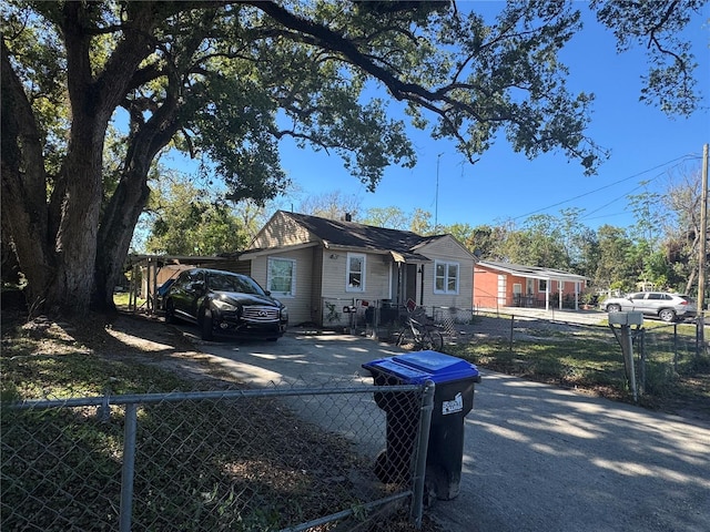 1500 43rd St, Orlando, FL 32839 - view of front of home with a fenced front yard and driveway