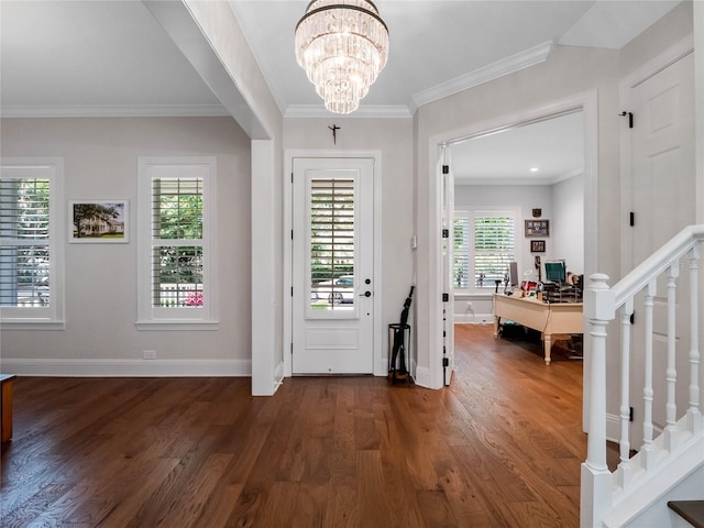 1438 Stickley Ave, Celebration, FL 34747 - foyer entrance with dark wood-style flooring, crown molding, baseboards, a chandelier, and stairs
