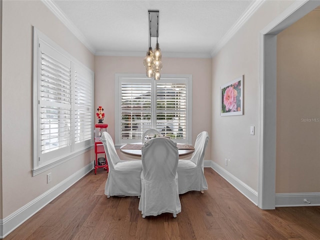 1438 Stickley Ave, Celebration, FL 34747 - dining area with healthy amount of natural light, ornamental molding, wood finished floors, and baseboards