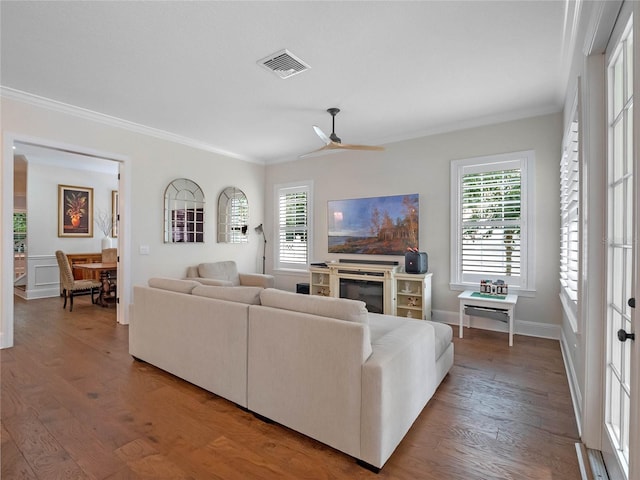 1438 Stickley Ave, Celebration, FL 34747 - living area featuring ornamental molding, wood finished floors, plenty of natural light, a ceiling fan, and baseboards
