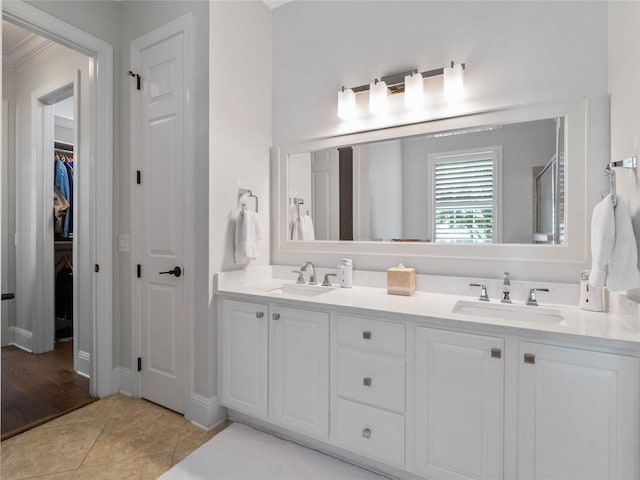 1438 Stickley Ave, Celebration, FL 34747 - full bath featuring double vanity, a spacious closet, and tile patterned floors