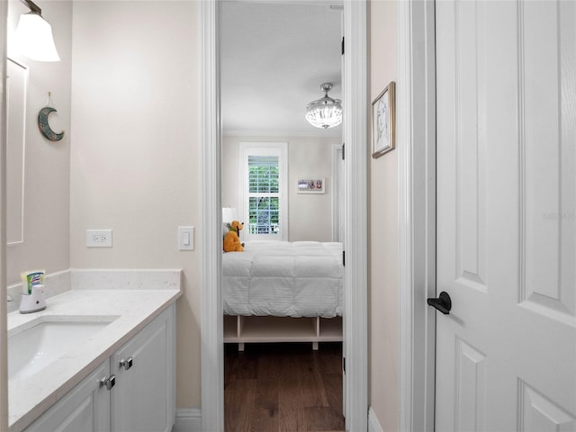 1438 Stickley Ave, Celebration, FL 34747 - ensuite bathroom with vanity and wood finished floors