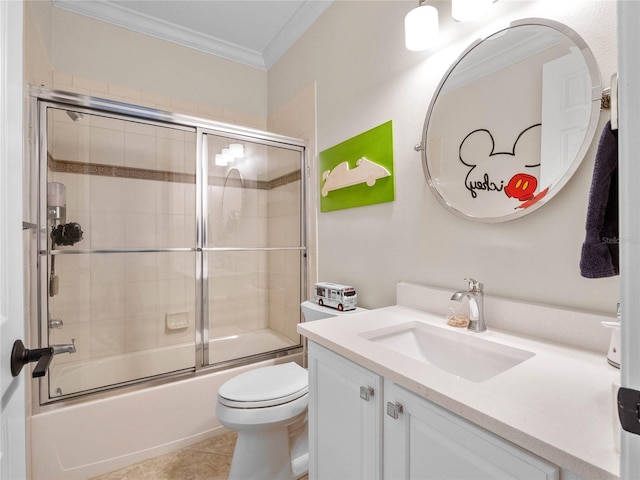1438 Stickley Ave, Celebration, FL 34747 - bathroom featuring crown molding, vanity, toilet, shower / bath combination with glass door, and tile patterned floors