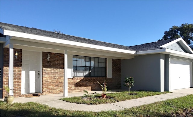 943 Millenbeck Ave, Deltona, FL 32725 - view of front of house featuring brick siding and a garage