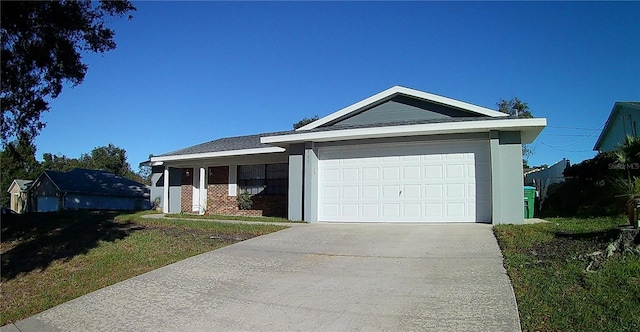 943 Millenbeck Ave, Deltona, FL 32725 - ranch-style home with driveway, an attached garage, a front yard, and brick siding