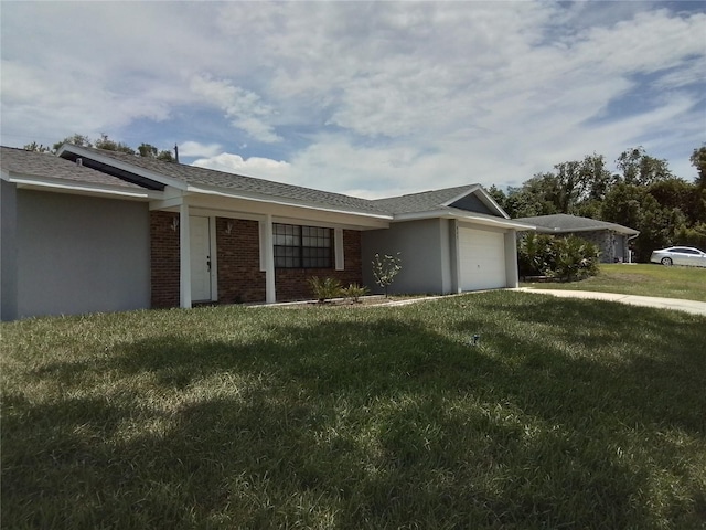 943 Millenbeck Ave, Deltona, FL 32725 - ranch-style home with a garage, a front lawn, stucco siding, and brick siding