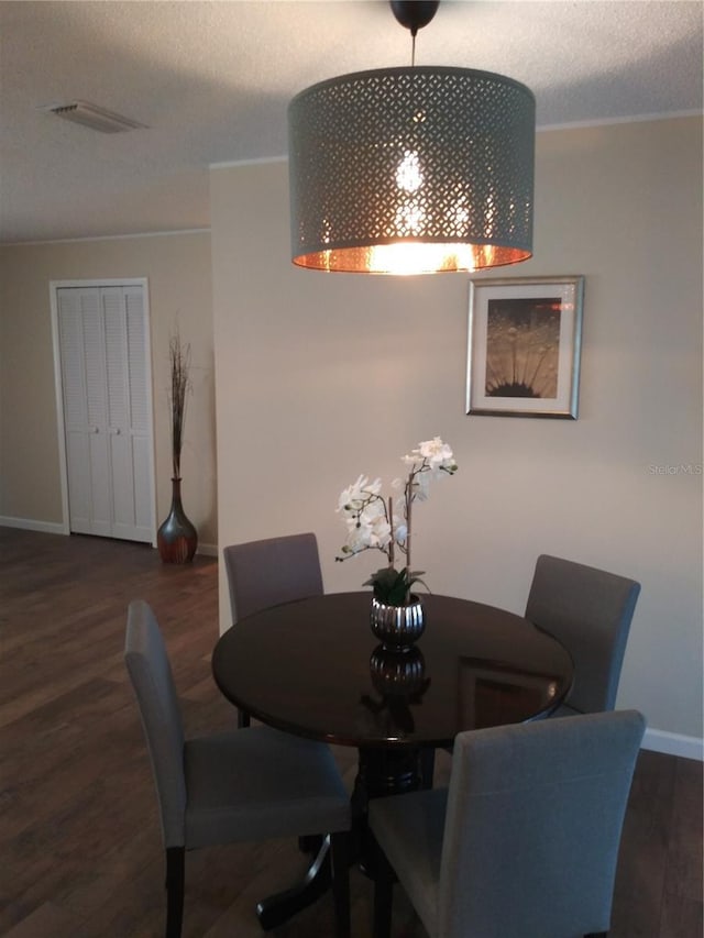943 Millenbeck Ave, Deltona, FL 32725 - dining room with wood finished floors, baseboards, and a textured ceiling