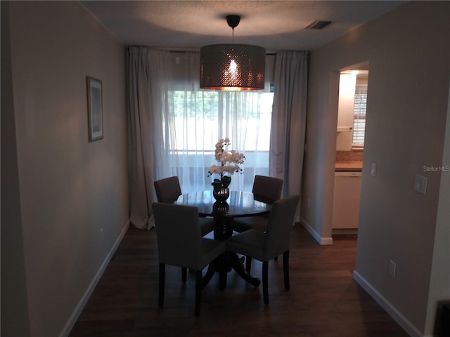 943 Millenbeck Ave, Deltona, FL 32725 - dining space with dark wood-style floors and baseboards
