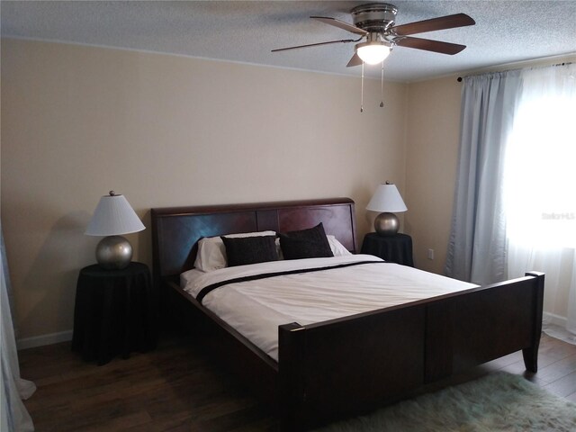 943 Millenbeck Ave, Deltona, FL 32725 - bedroom featuring wood finished floors, a textured ceiling, ceiling fan, and baseboards