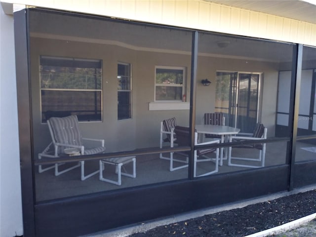 943 Millenbeck Ave, Deltona, FL 32725 - view of patio / terrace featuring a sunroom
