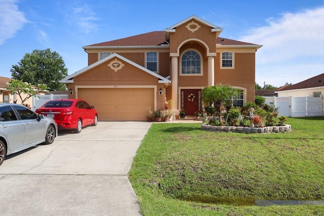 314 Edgewood Ct, Kissimmee, FL 34759 - view of front facade with stucco siding, an attached garage, and driveway