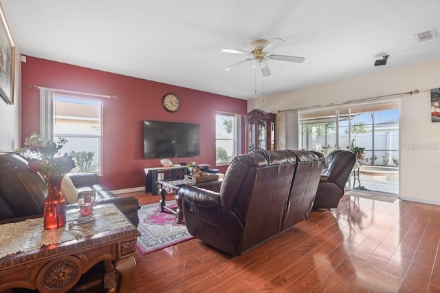 314 Edgewood Ct, Kissimmee, FL 34759 - living room featuring a ceiling fan, wood finished floors, and baseboards
