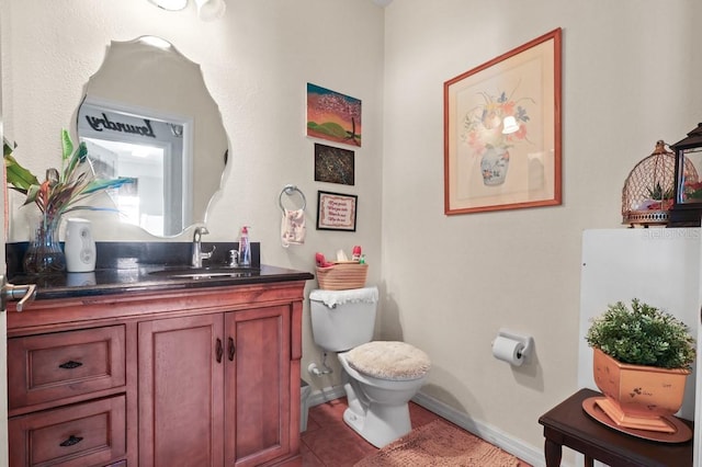 314 Edgewood Ct, Kissimmee, FL 34759 - bathroom with toilet, vanity, tile patterned flooring, and baseboards