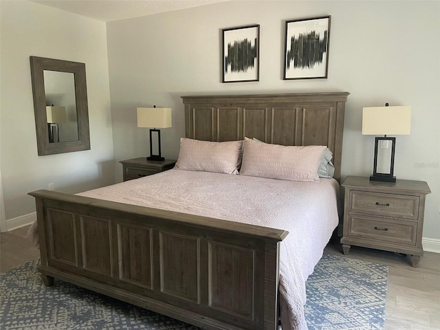302 Coco Plum Ct, Oldsmar, FL 34677 - bedroom with baseboards and light wood-type flooring