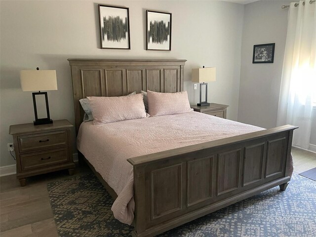 302 Coco Plum Ct, Oldsmar, FL 34677 - bedroom with dark wood-type flooring and baseboards