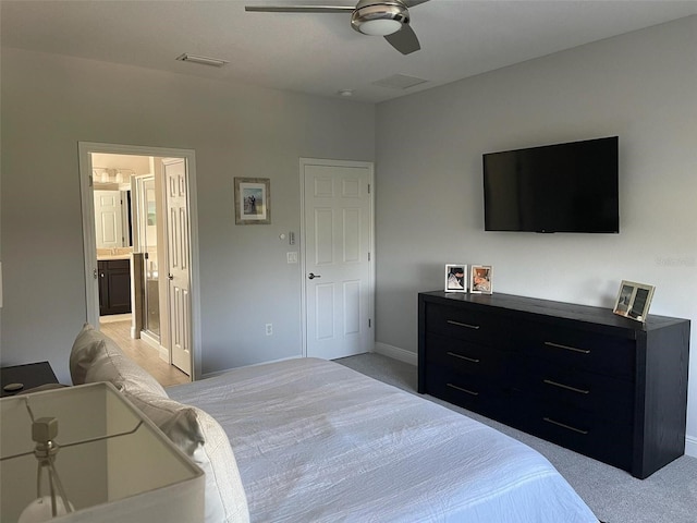 302 Coco Plum Ct, Oldsmar, FL 34677 - bedroom featuring light carpet, ensuite bath, baseboards, and a ceiling fan